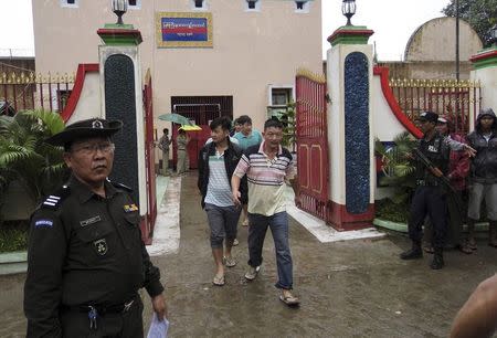 Chinese nationals, who were jailed for illegal logging, walk out of Myitkyina prison after being released during an amnesty in Myitkyina, the capital of Kachin State, north of Myanmar, July 30, 2015. REUTERS/Stringer