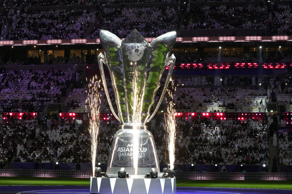 FILE - A giant replica of the trophy is displayed on the pitch before the Asian Cup Group A soccer match between Qatar and Lebanon at the Lusail Stadium in Lusail, Qatar, Friday, Jan. 12, 2024. (AP Photo/Thanassis Stavrakis, File)