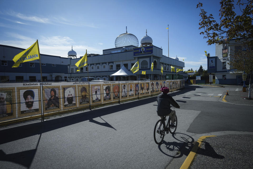 A man rides a bike outside the Guru Nanak Sikh Gurdwara Sahib in Surrey, British Columbia, on Monday, Sept. 18, 2023, where temple president Hardeep Singh Nijjar was gunned down in his vehicle while leaving the temple parking lot in June. Canada expelled a top Indian diplomat Monday as it investigates what Prime Minister Justin Trudeau called credible allegations that India’s government may have had links to the assassination in Canada of a Sikh activist.(Darryl Dyck/The Canadian Press via AP)