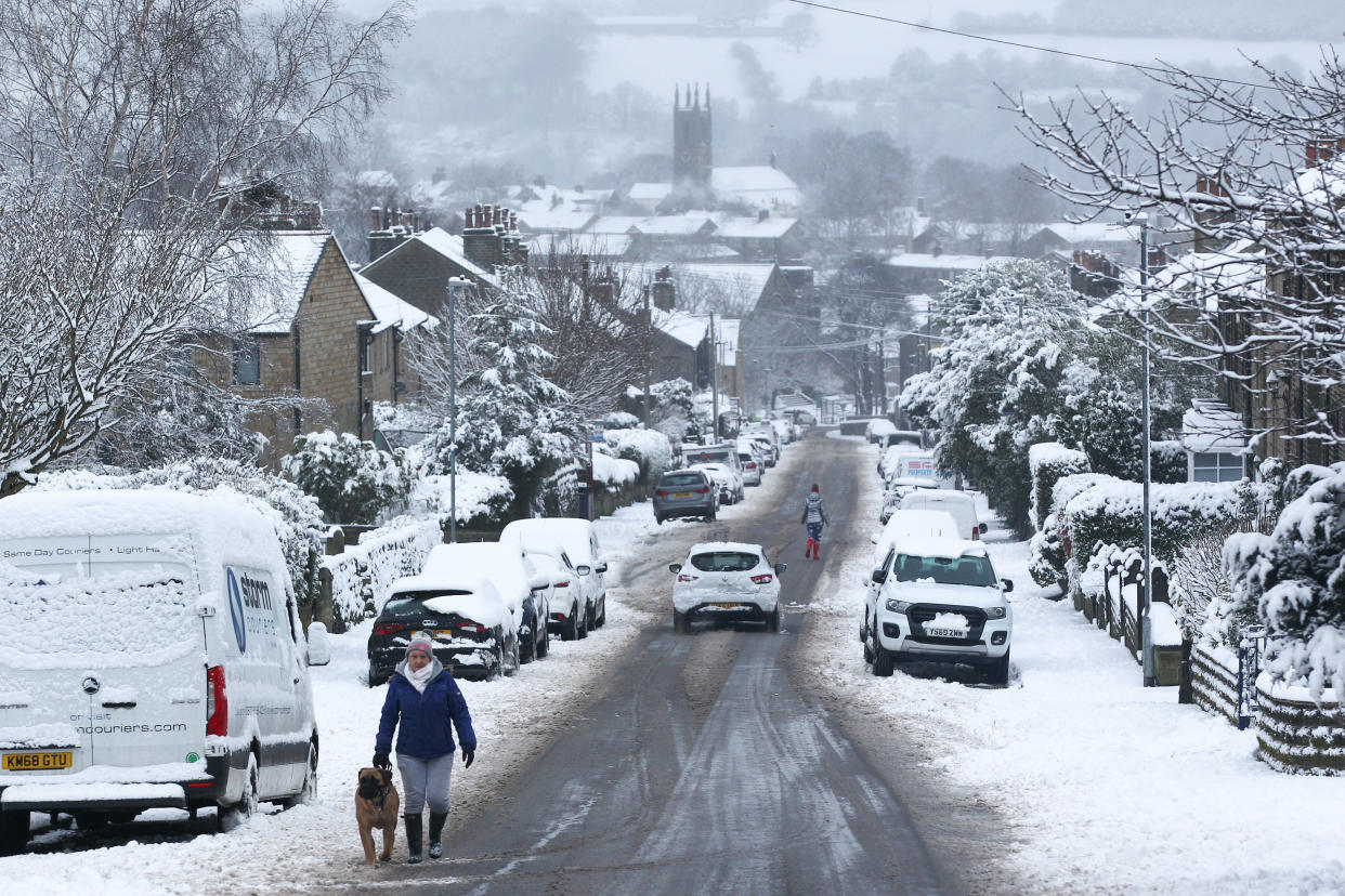  A person walks his dog on a snowy morning in the West Yorkshire village of Honley.
Heavy snow fell overnight in West Yorkshire, causing dangerous driving conditions. (Photo by Adam Vaughan / SOPA Images/Sipa USA) 