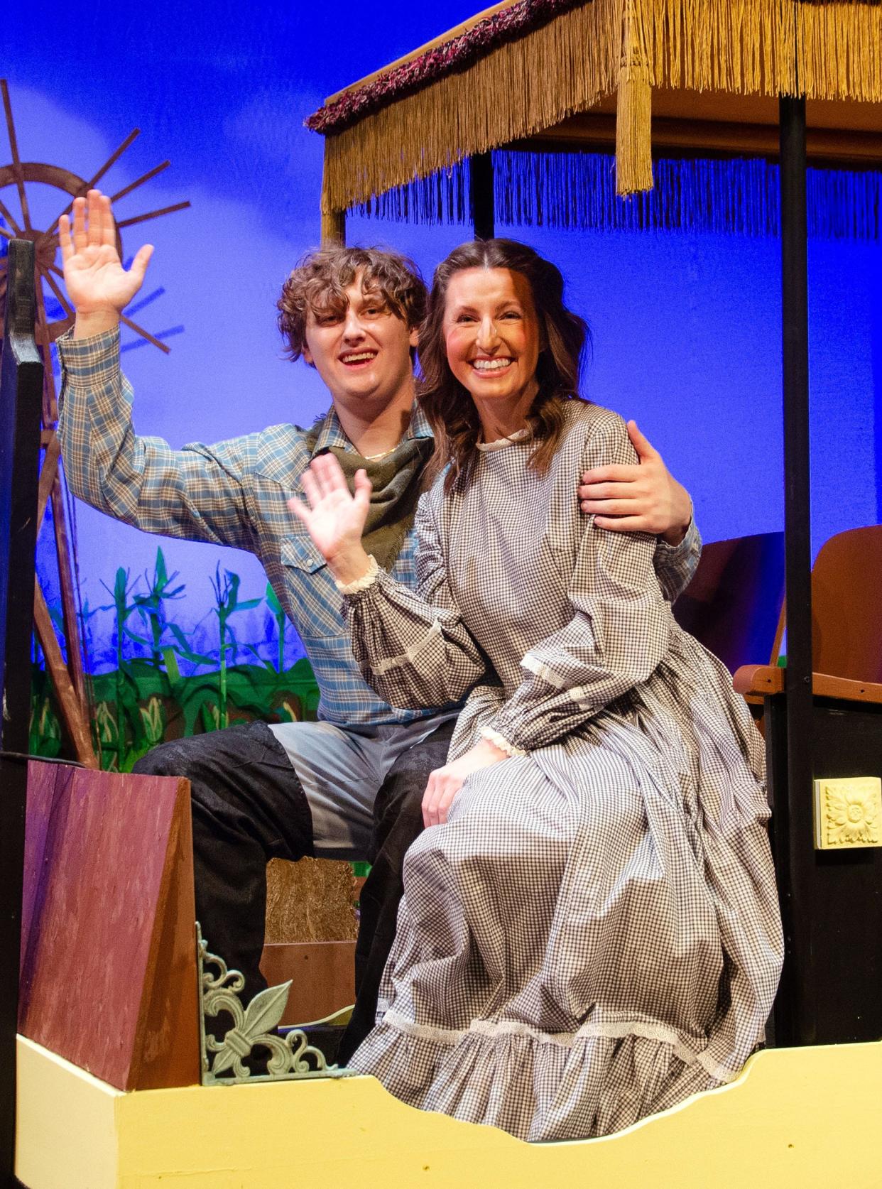 Laurey (Alison Matas Smith) and Curly (Tim Pinter III) take a ride in their “Surrey with the Fringe on Top” during a scene in Carnation City Players' production of "Oklahoma!" The show runs Feb. 16-18 and Feb. 23-25 at Firehouse Theater in Alliance.