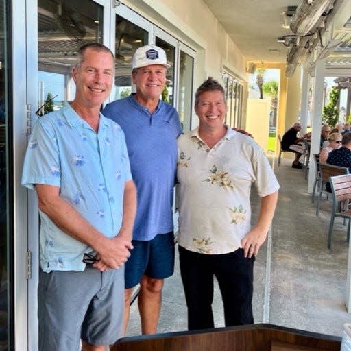 From left, Next Door Beach Bistro Director of Operations Tim Griffin, two-time Daytona 500 winner Michael Waltrip and Next Door Beach Bistro Restaurant Manager Scott Ridge at Next Door Beach Bistro in Flagler Beach.