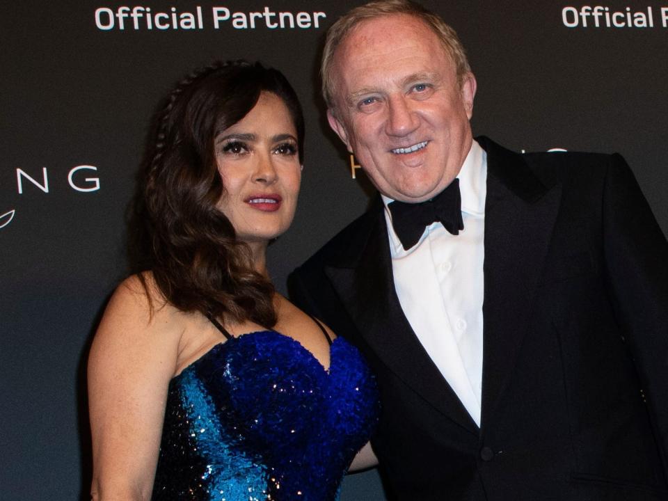 Salma Hayek and Francois-Henri Pinault posing at a red carpet in July 2021.