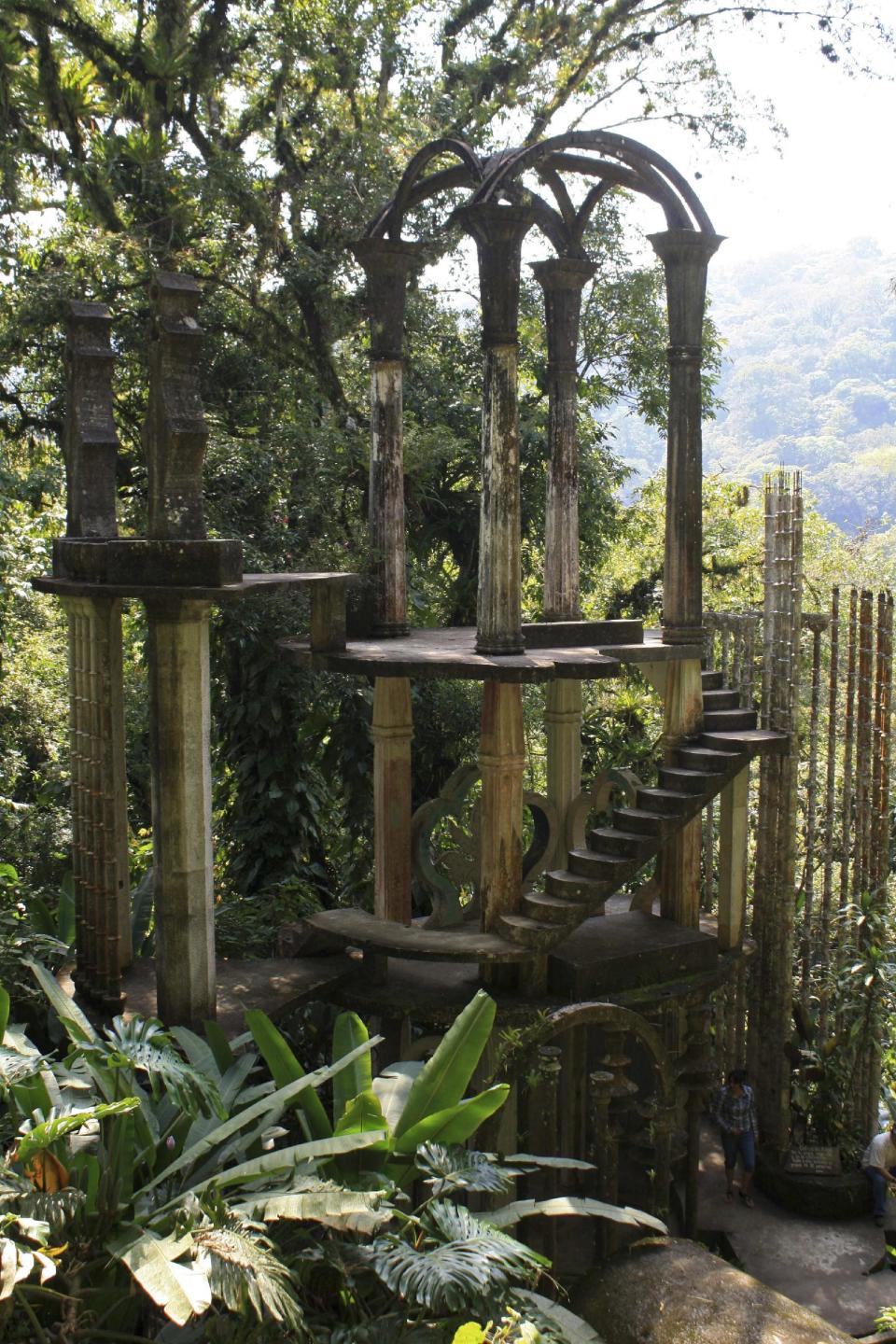 This Feb. 1, 2014 photo shows a view of Las Pozas, Mexico, a dreamy, little-known garden of surreal art, created by the late Edward James, a British multimillionaire and arts patron who favored surrealists like Rene Magritte and Salvador Dali. The ferocity of the jungle in these hills of the Sierra Madre, a seven-hour drive from Mexico City, has destroyed many structures in the garden. But that didn’t bother James, who liked to think that future archaeologists would discover his lost city and wonder what kind of civilization had built it, said Carlos Barbosa, a park guide. (AP Photo/Teresa de Miguel Escribano)