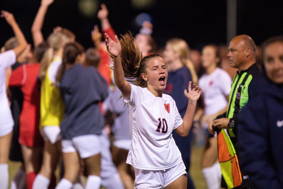 Sacred Heart junior Nora Dimmitt (10) celebrates after winning a KHSAA Seventh Region girls soccer semifinal game against Manual at Eastern High School on Monday. The Valkyries beat the Crimsons 5-1.