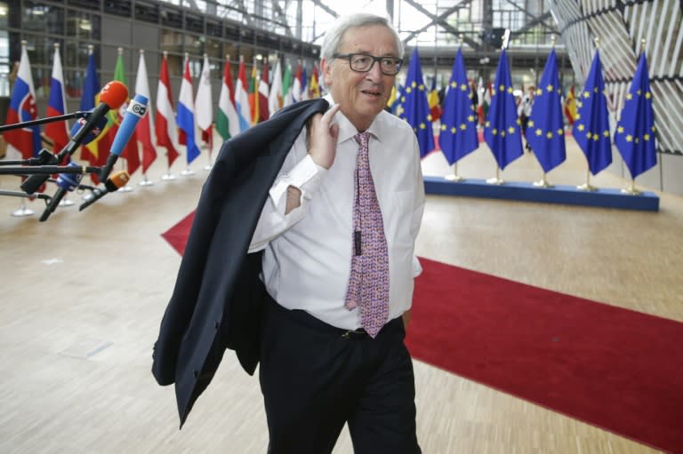 Jean-Claude Juncker talks to reporters as he arrives for the second day of an EU summit in Brussels, on June 23, 2017