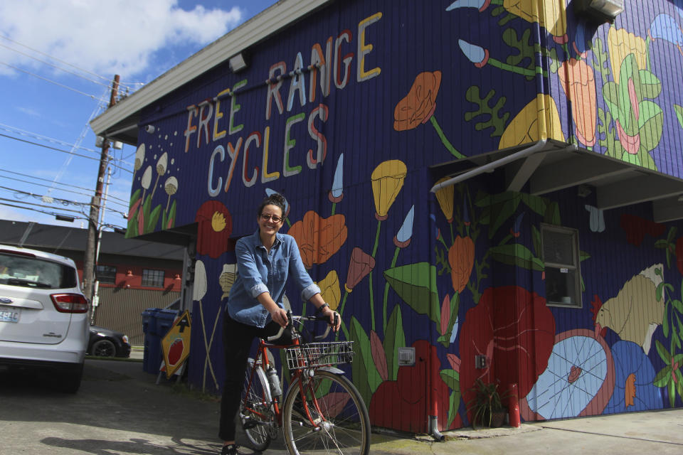 Shawna Williams, owner of Free Range Cycles, poses outside her shop on May 6, 2024, in Seattle, Wash. Williams didn't have the sales surge others did because her 700 square foot shop was so small she kept it open by appointment only from March 2020 to May 2021. (AP Photo/Manuel Valdes)