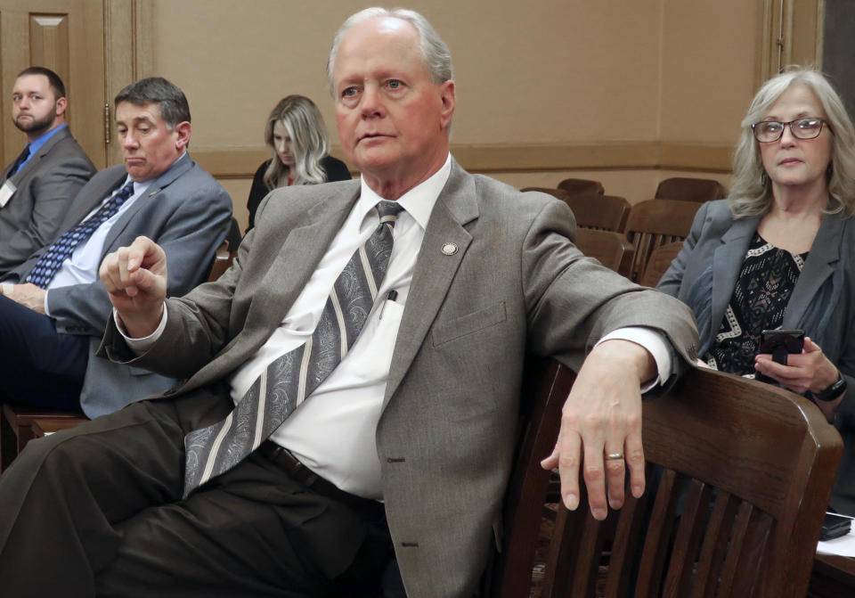 In this Wednesday, Feb. 20, 2019 photo, Kansas state Sen. Gene Suellentrop, R-Wichita, asks a question about a health coverage bill during a meeting of GOP senators at the Statehouse in Topeka, Kan. The bill, supported by Suellentrop and other Republicans, allows the Kansas Farm Bureau to offer health coverage to its members without having to comply with federal Affordable Care Act mandates. (AP Photo/John Hanna)