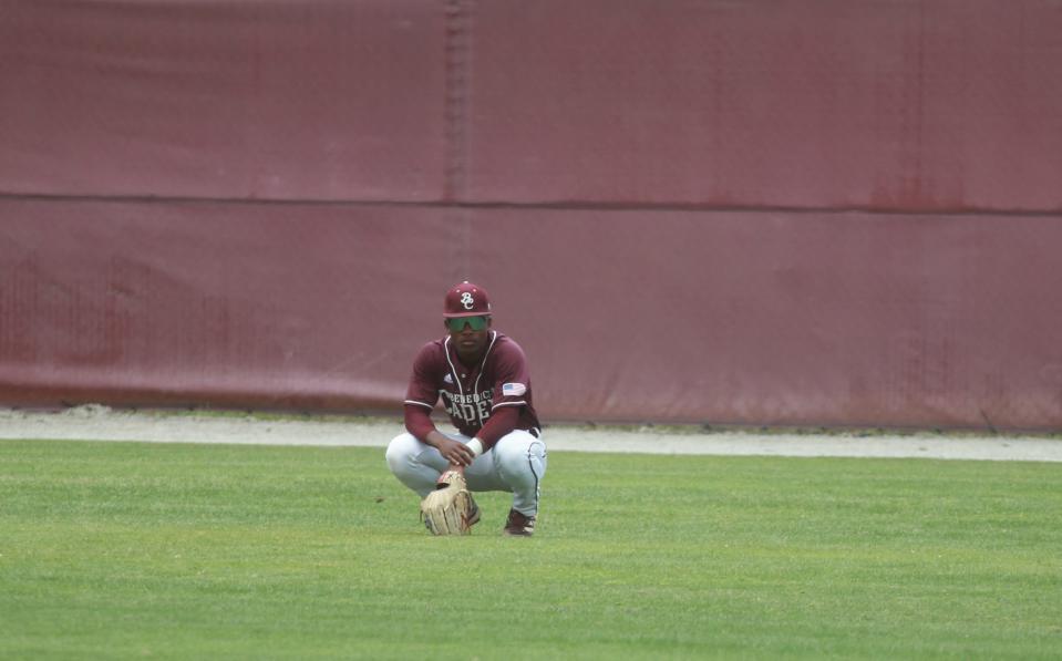 Benedictine's Justin Thomas takes a break out in center field during the first game of Saturday's doubleheader against North Oconee.