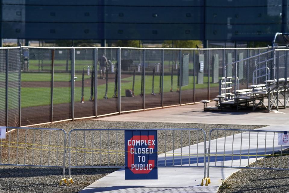 The entrances to the Cleveland Indians spring training facility are closed to the public due to the ongoing COVID-19 outbreak prior to the first day of full squad spring training baseball practice Monday, Feb. 22, 2021, in Goodyear, Ariz. (AP Photo/Ross D. Franklin)