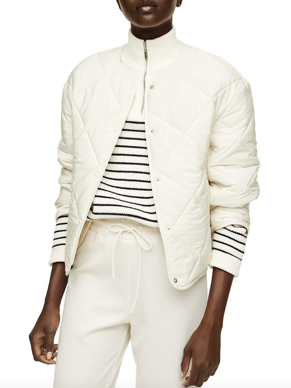 Mango Ultralight Button-Down Quilted Jacket in white with white pants and striped sweater