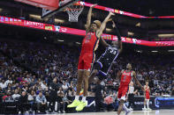 Sacramento Kings guard Keon Ellis (23) shoots as New Orleans Pelicans guard Trey Murphy III (25) defends during the first half of an NBA basketball game Thursday, April 11, 2024, in Sacramento, Calif. (AP Photo/Benjamin Fanjoy)