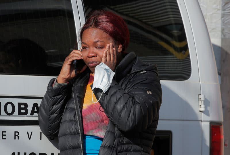 Woman cries outside Wyckoff Heights Medical Center during outbreak of coronavirus disease (COVID-19) in New York