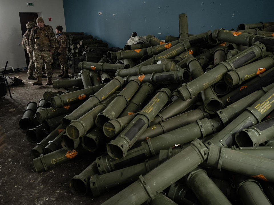A Ukrainian serviceman from the 93rd brigade stands near a pile of empty mortar shell containers, in Bakhmut, February 15, 2023. / Credit: YASUYOSHI CHIBA/AFP via Getty Images