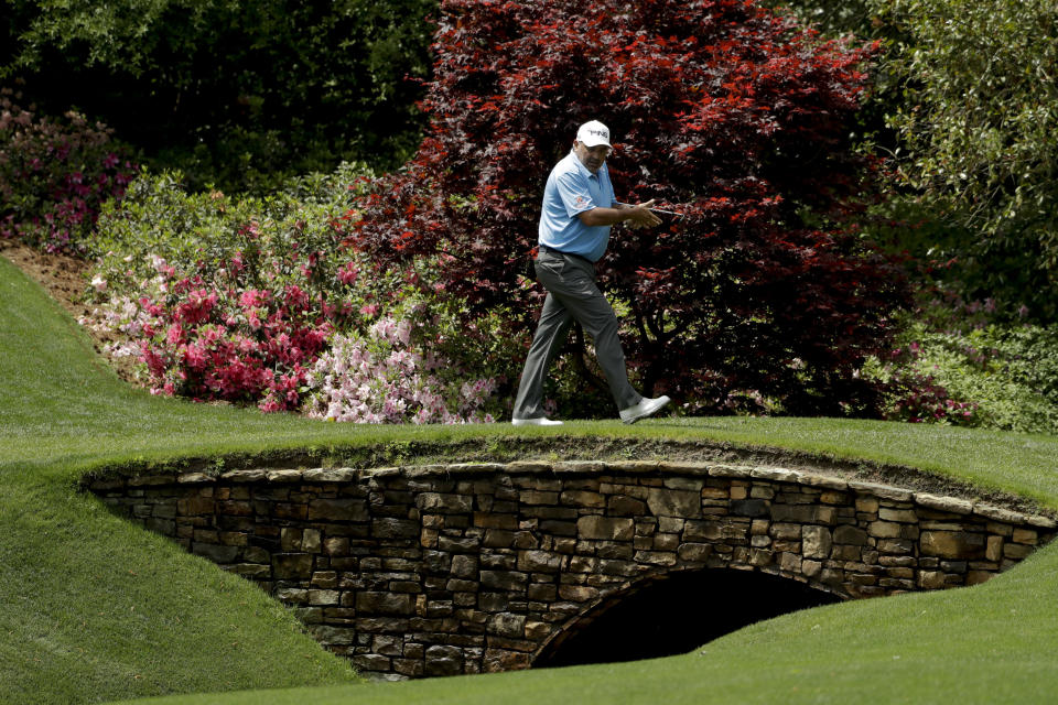 Angel Cabrera, of Argentina, walks over the bridge on the 13th hole during a practice round for the Masters golf tournament Tuesday, April 9, 2019, in Augusta, Ga. (AP Photo/Marcio Jose Sanchez)