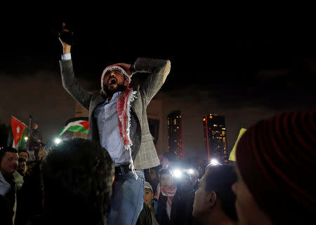 A demonstrator gestures during a protest against the government's tough austerity measures in Amman, Jordan December 13, 2018. REUTERS/Muhammad Hamed