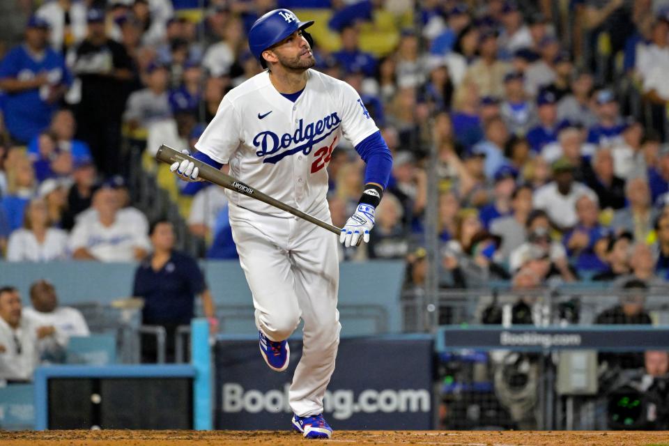 Oct 9, 2023; Los Angeles, California, USA; Los Angeles Dodgers designated hitter J.D. Martinez (28) hits a home run against the Arizona Diamondbacks during the fourth inning for game two of the NLDS for the 2023 MLB playoffs at Dodger Stadium.