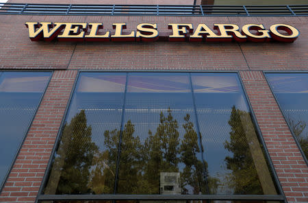 FILE PHOTO: The sign at a Wells Fargo banking location is pictured in Pasadena, California, U.S., September 8, 2017. REUTERS/Mario Anzuoni/File Photo