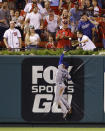 Los Angeles Dodgers center fielder Enrique Hernandez cannot catch a home run hit by St. Louis Cardinals' Tyson Ross during the fifth inning of a baseball game Thursday, Sept. 13, 2018, in St. Louis. (AP Photo/Billy Hurst)