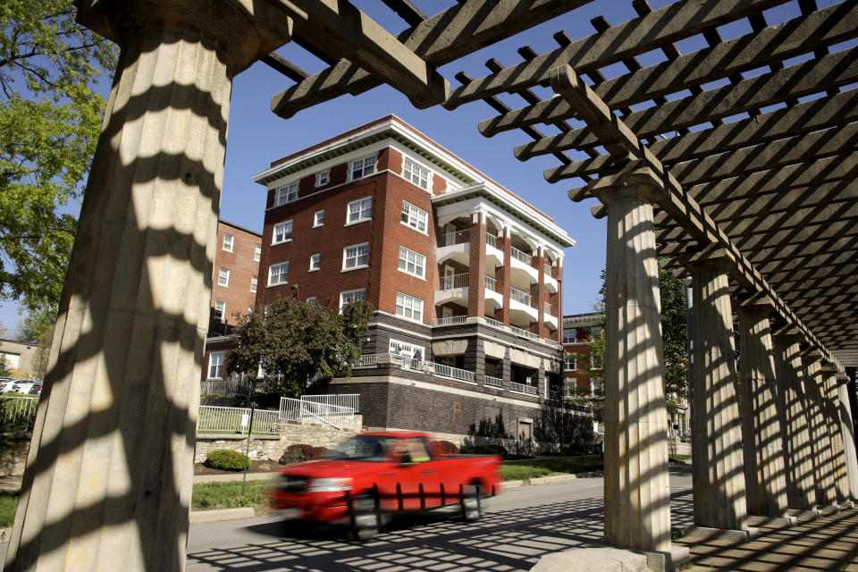 FILE - In this April 26, 2019, file photo, a motorist is framed by an ornate pergola in the median of the newly-named Dr. Martin Luther King Jr. Boulevard in Kansas City, Mo. More than 50 years after King was assassinated, the city's efforts to honor the civil rights leader has met opposition from citizens opposed to the renaming of The Paseo, one of the city's iconic boulevards. (AP Photo/Charlie Riedel, File)