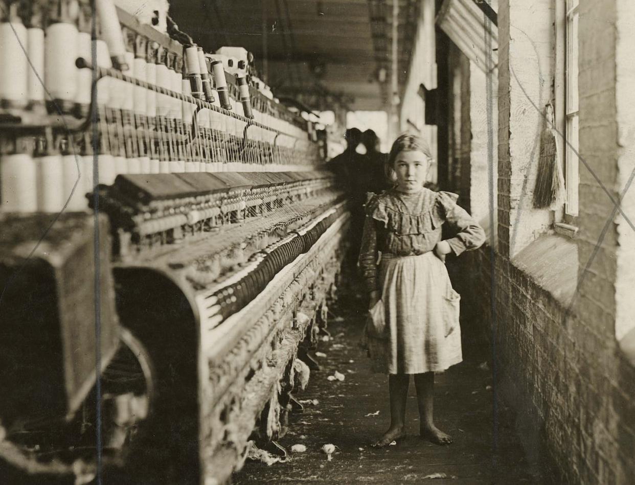 Lewis Wickes Hine, 'A little spinner in a Georgia Cotton Mill, 1909.' Gelatin silver print, 5 x 7 in. The Photography Collections, University of Maryland, Baltimore County (P545), <a href="http://creativecommons.org/licenses/by-sa/4.0/" rel="nofollow noopener" target="_blank" data-ylk="slk:CC BY-SA;elm:context_link;itc:0;sec:content-canvas" class="link ">CC BY-SA</a>