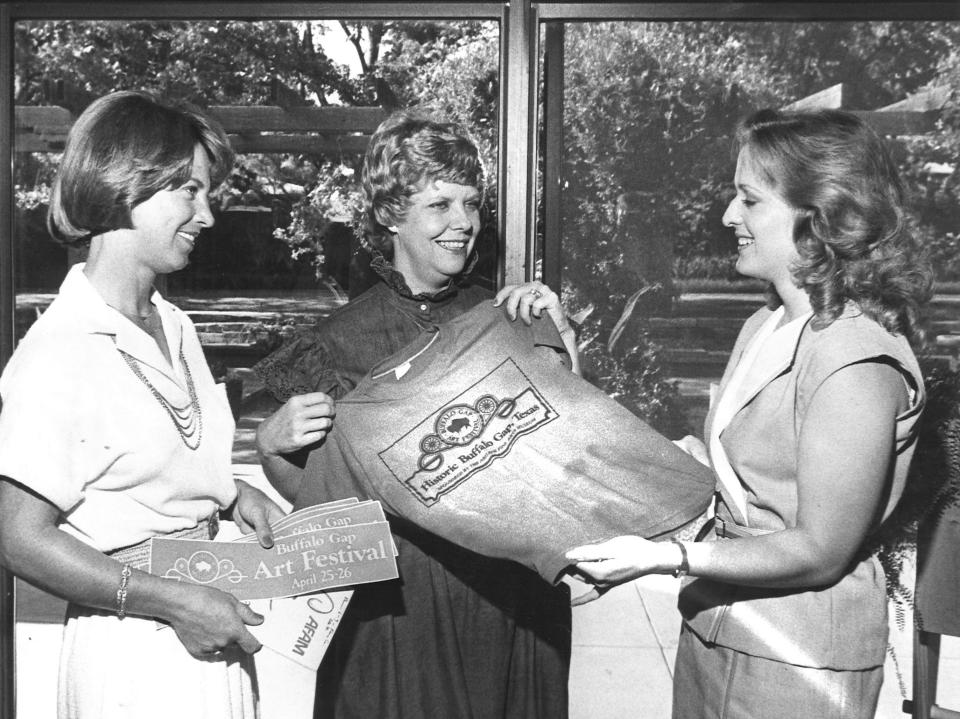 Los Aficionados members Judy Colvin (left) and Christie Galbraith (center) try to get Becky Roberts to join the group that supported the Abilene Fine Arts Museum in 1981.