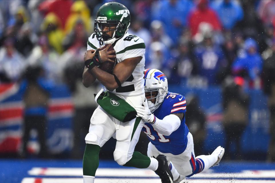 New York Jets wide receiver Jamison Crowder (82) catches a pass for a touchdown in front of Buffalo Bills' Dean Marlowe (31) during the second half of an NFL football game Sunday, Dec. 29, 2019 in Orchard Park, N.Y. (AP Photo/Adrian Kraus)