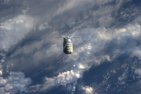 Orbital Sciences' first Cygnus spacecraft is seen nearing the International Space Station in this photo taken by an astronaut aboard the orbiting lab on Sept. 29, 2013, during the spacecraft's first rendezvous.