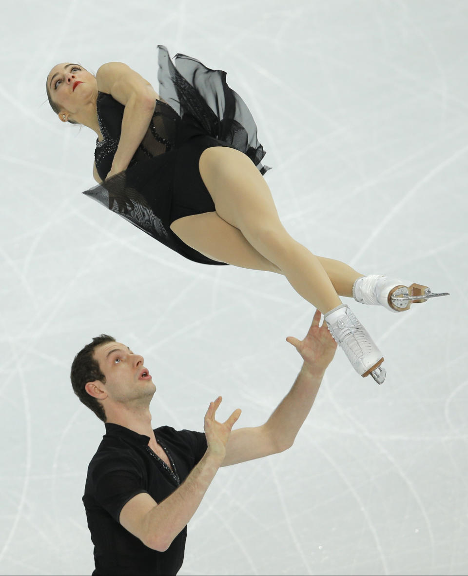 Marissa Castelli and Simon Shnapir of the United States compete in the team pairs short program figure skating competition at the Iceberg Skating Palace during the 2014 Winter Olympics, Thursday, Feb. 6, 2014, in Sochi, Russia. (AP Photo/Vadim Ghirda)