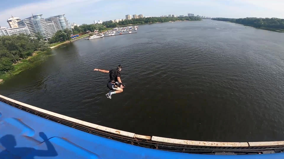 This heart-stopping footage shows a daredevil jumping from a speeding train into a river below. Yaro Panchenko, 18, is seen 'surfing' the subway car as it moves through his home town of Kiev in the Ukraine on August 1 this year. Not content with just surfing the train, Yaro then leaps from the carriage as it crosses a bridge into the water below. However, it didn't go entirely to plan as his Go Pro camera hit him in the face on impact and knocked out a tooth.