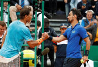 Tennis - ATP 1000 - Monte Carlo Masters - Monte-Carlo Country Club, Roquebrune-Cap-Martin, France - April 20, 2019 Italy's Fabio Fognini shakes hands with Spain's Rafael Nadal after their semi final match REUTERS/Eric Gaillard