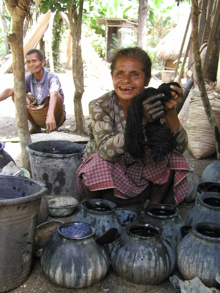 Paint it blue: Oenenu from West Timor after dying a fabric using the Indigo plant. (