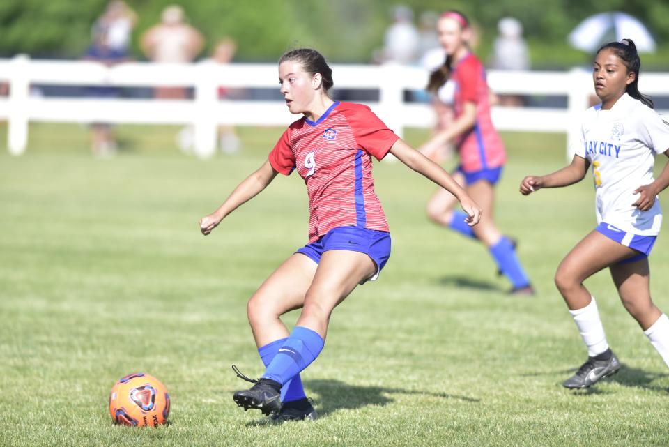 St. Clair's Kaylen Walker passes the ball during a game earlier this season. The Saints beat Goodrich, 4-1, in a Division 2 regional semifinal on Tuesday.