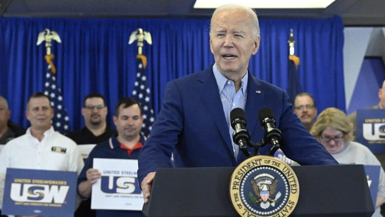 Biden with United Steelworkers members behind him