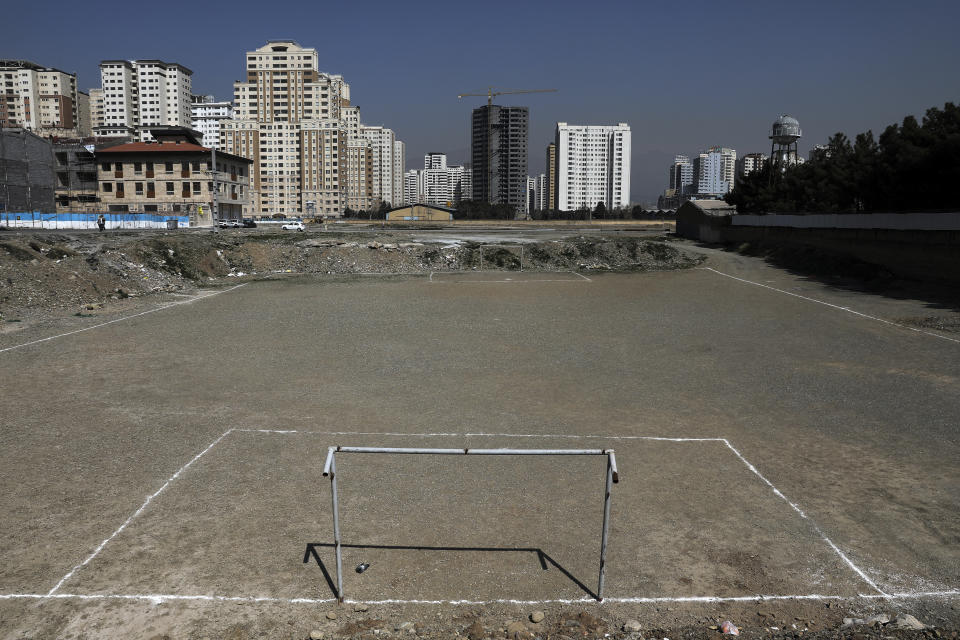 In this Thursday, March 12, 2020 photo, a empty soccer football field with dirt surface is seen in Tehran, Iran. The typically frenetic streets of Iran’s capital, Tehran, have fallen silent and empty due to the new coronavirus outbreak that’s gripped the Islamic Republic. The typically frenetic streets of Iran’s capital, Tehran, have fallen silent and empty due to the new coronavirus outbreak that’s gripped the Islamic Republic. (AP Photo/Ebrahim Noroozi)