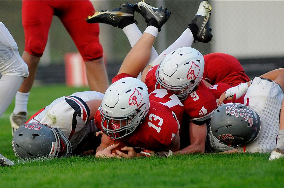 Loudonville High School's Matt Sprang (13) scores with help rfrom Loudonville High School's James Henley (9) during football action between Centerburg and Loudonville at Redbird Stadium  Friday September 16,2022  Steve Stokes/for Ashland Times-Gazette