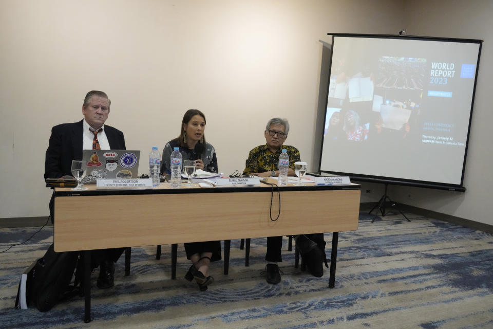 Asia Director of Human Rights Watch Elaine Pearson, center, accompanied with Deputy Director, Asia division human rights watch Phil Robertson, left, and Indonesian researche Andreas Harsono, left ,talks to journalist during a press conference in Jakarta, Indonesia, Thursday, Jan. 12, 2022. Widespread opposition to Russia's invasion of Ukraine demonstrates the strength of a unified response against human rights abuses, and there are signs that power is shifting as people take to the streets to demonstrate their dissatisfaction in Iran, China and elsewhere, a leading rights group said Thursday.(AP Photo/Achmad Ibrahim)