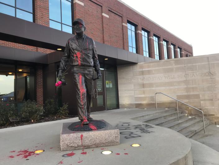 The statue of Bo Schembechler on the University of Michigan&#39;s campus was vandalized with paint and a message of support for survivors of Robert Anderson&#39;s abuse in front of the football building on the University of Michigan campus in Ann Arbor Wednesday, Nov. 24, 2021.