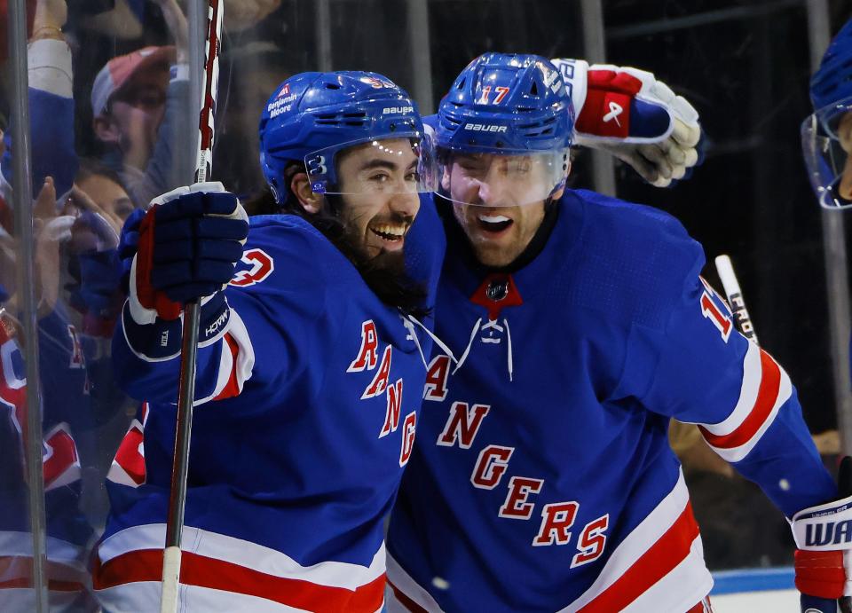 NEW YORK, NEW YORK - DECEMBER 12: Blake Wheeler #17 of the New York Rangers (R) celebrates his second period goal against Toronto Maple Leafs and is joined by Mika Zibanejad #93 (L) at Madison Square Garden on December 12, 2023 in New York City.