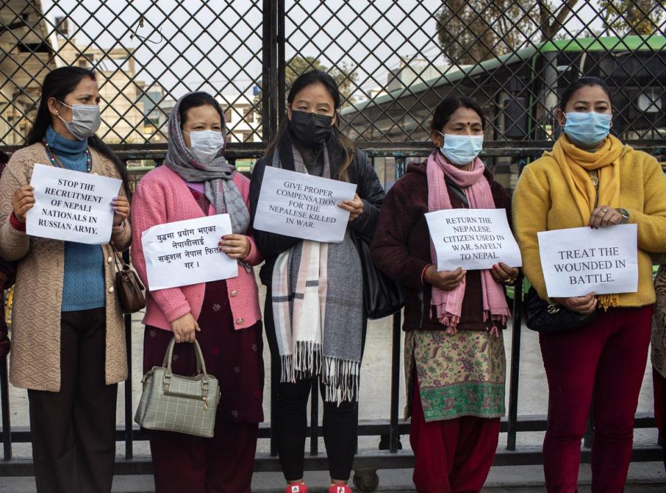 Tina (3-L) and Sita (3-R) at a protest in Kathmandu. Their husbands joined the Russian army four months earlier and are not allowed to return to Nepal before the end of their one-year contract (EPA)