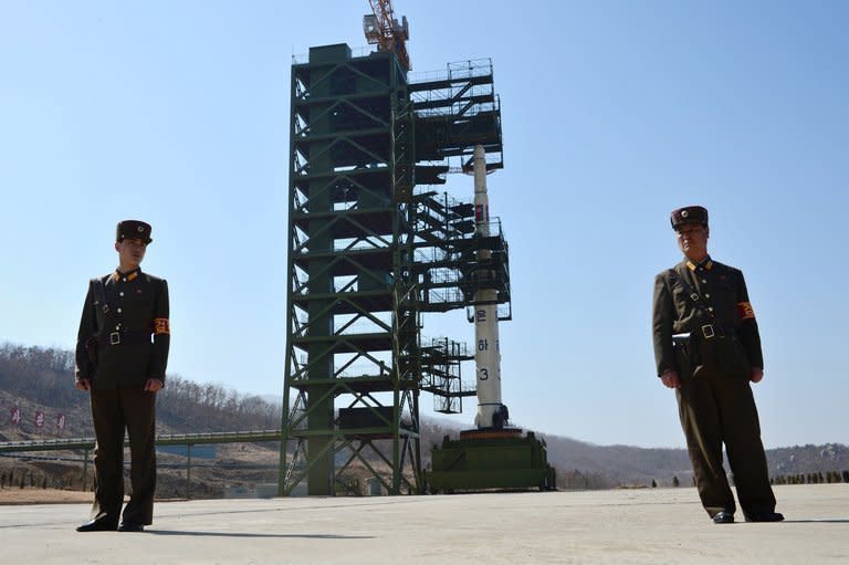 North Korean soldiers guard the Unha-3 rocket at Tangachai-ri space center, April 8, 2012. The United States and China on Tuesday called on the UN Security Council to sanction North Korean diplomats and "illicit" cash transfers to step up pressure on Pyongyang's nuclear program