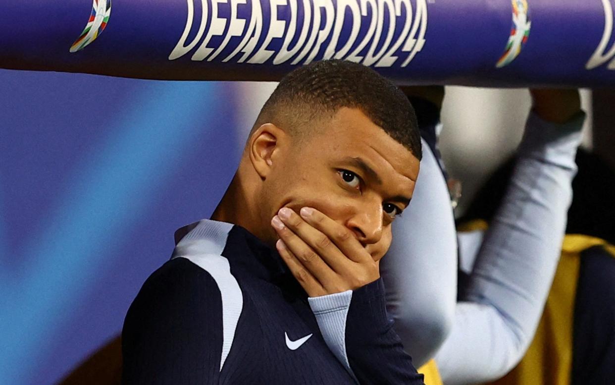 France's Kylian Mbappe reacts after the match