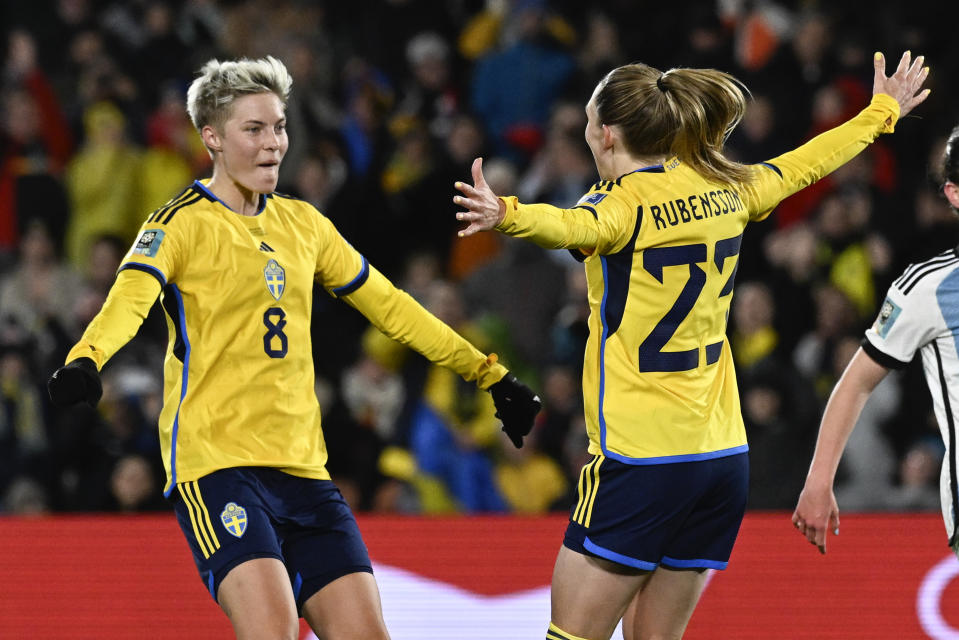 Sweden's Elin Rubensson, right, celebrates with teammate Lina Hurtig after scoring her team's second goal; during the Women's World Cup Group G soccer match between Argentina and Sweden in Hamilton, New Zealand, Wednesday, Aug. 2, 2023. (AP Photo/Andrew Cornaga)