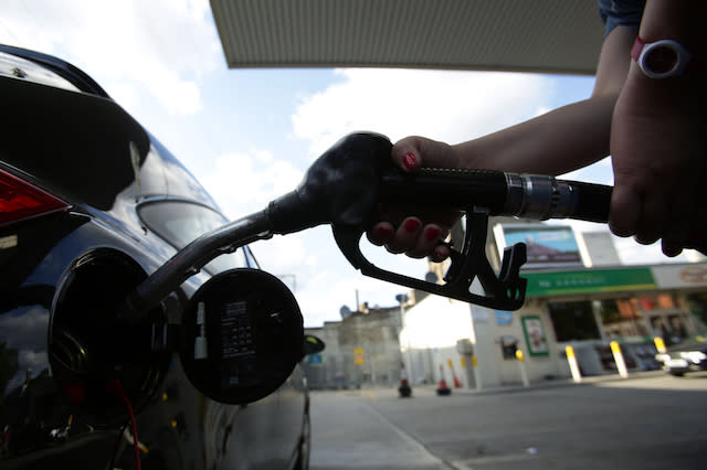A car being filled up with a pump at a petrol station in London. PRESS ASSOCIATION Photo. Picture date: Sunday August 3, 2014. Photo credit should read: Yui Mok/PA Wire