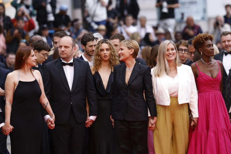 "Me Too" director Judith Godreche, third from left, poses for photographers upon arrival at the premiere of the film 'Furiosa: A Mad Max Saga' at the 77th international film festival, Cannes, southern France, Wednesday, May 15, 2024. (Photo by Vianney Le Caer/Invision/AP)