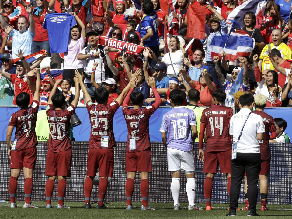 Thailand's players celebrate in front of their supporters after the Women's World Cup Group F soccer match between Sweden and Thailand at the Stade de Nice in Nice, France, Sunday, June 16, 2019. Sweden defeated Thailand by 5-1. (AP Photo/Claude Paris)