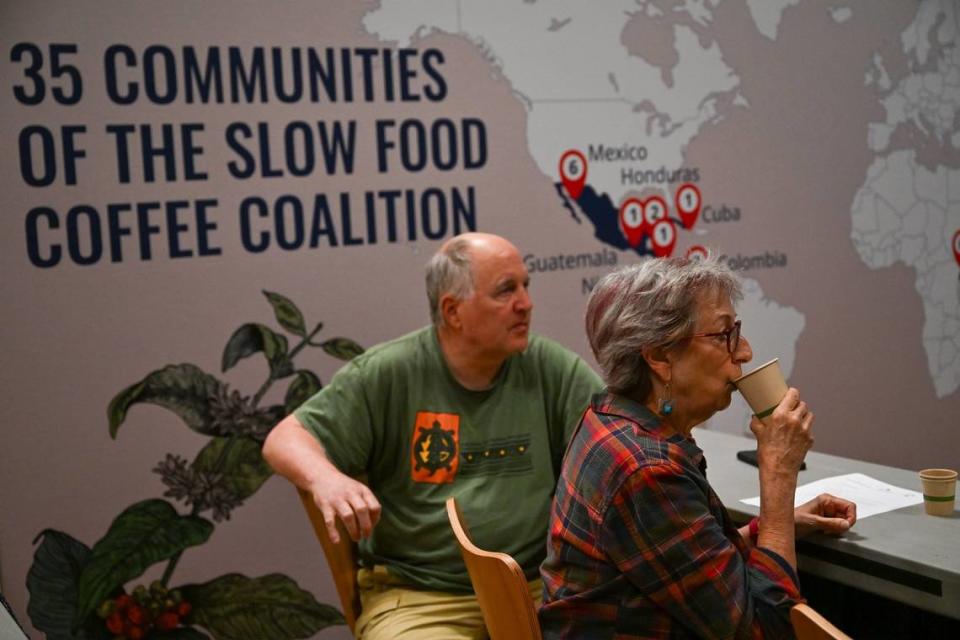 Sacramento resident Mimi Budd tastes coffee made during a barista class alongside Phil Goldcamp during an inaugural Terra Madre Americas event at the Sacramento Memorial Auditorium on Friday.