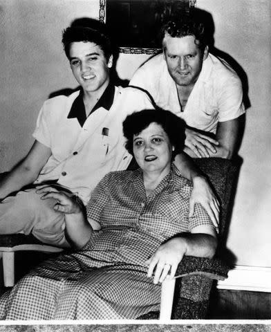 <p>RB/Redferns</p> Elvis Presley with his parents Gladys and Vernon