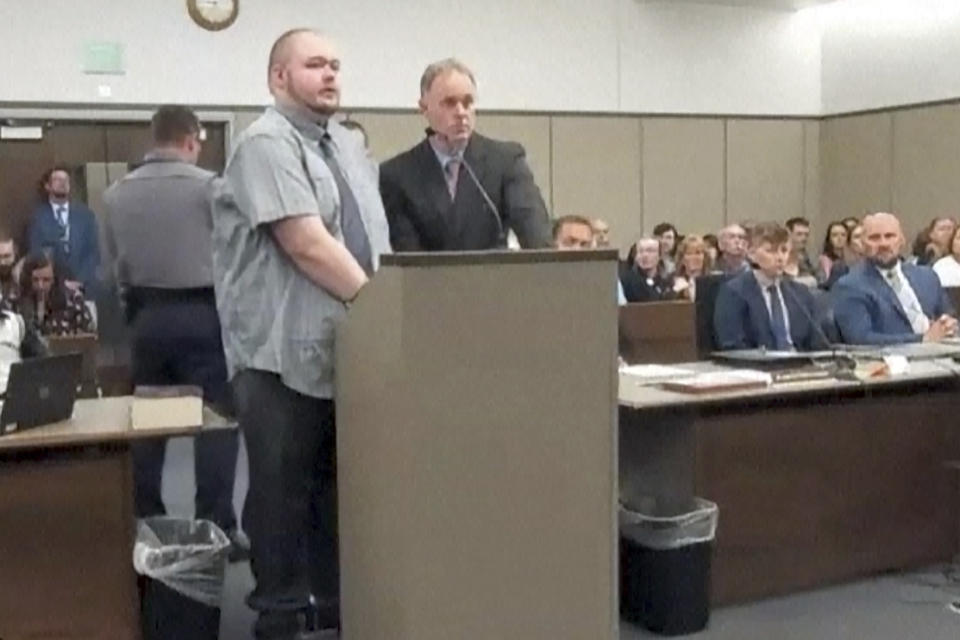 In this image taken from video provided by the Colorado Judicial Branch, Anderson Lee Aldrich, left, the suspect in a mass shooting that killed five people at a Colorado Springs LGBTQ+ nightclub last year, appears in court Monday, June 26, 2023, in Colorado Springs, Colo., where they pleaded guilty in the attack. The defendant faces life in prison on the murder charges under the plea agreement. (Colorado Judicial Branch via AP)