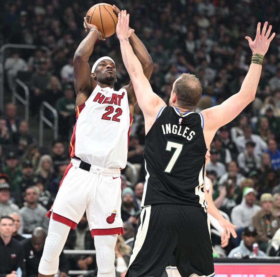 Miami Heat’s Jimmy Butler (22) shoots over Milwaukee’s Joe Ingles in Game 1 of their NBA first round playoff series Sunday night in Milwaukee.